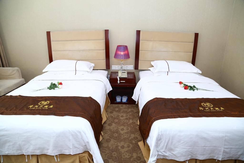 Long Zhou Grand Hotel Guangzhou Rum bild